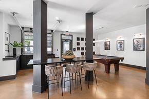 Atlanta apartment for rent - A room with a pool table and a bar area.