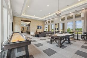 Broomfield apartment for rent - a game room with a shuffleboard table and a pool table