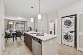 Atlanta apartment for rent - A modern kitchen with a dining table and chairs.