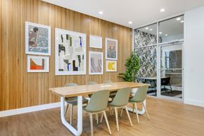 Tampa apartment for rent - a dining room with a table and chairs and pictures on the wall