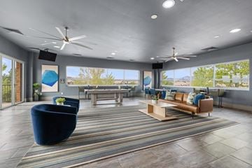 Superior apartment for rent - A spacious living room with a blue sofa and a wooden coffee table.