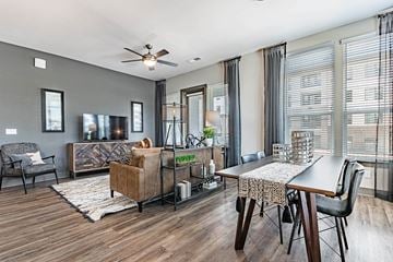 Raleigh apartment for rent - a living room and dining room with a couch and a table