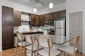 Sanford apartment for rent - A kitchen with a table and chairs.