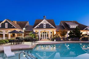 Mooresville apartment for rent - A large house with a pool in front.