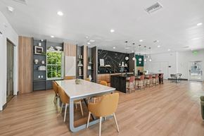 Palm Harbor apartment for rent - A modern dining room with a large table and chairs.