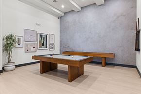 Miramar apartment for rent - A room with a pool table and pictures on the wall.