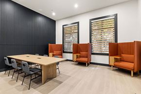 Miramar apartment for rent - A conference room with a long table, chairs, and a window with blinds.