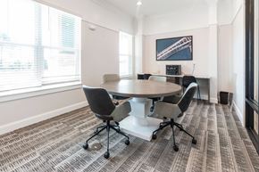 Mooresville apartment for rent - a meeting room with a table and chairs