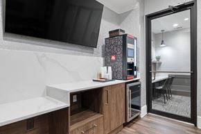 Atlanta apartment for rent - A modern kitchen with a refrigerator and a microwave.