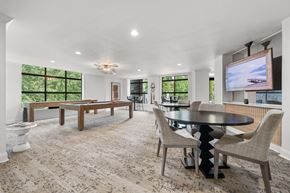 Atlanta apartment for rent - A modern dining room with a large table and chairs.