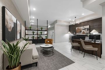 Atlanta apartment for rent - A modern living room with a grey carpet and a white sofa.