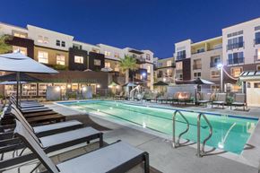 Corte Madera apartment for rent - a swimming pool at night with an apartment building in the background