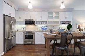 Corte Madera apartment for rent - a kitchen with stainless steel appliances and a wooden table