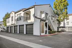 Murrieta apartment for rent - A white two-story building with a balcony on the second floor.