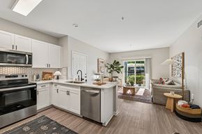 Murrieta apartment for rent - A modern kitchen with stainless steel appliances and white cabinets.