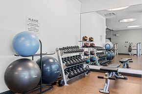 Boston apartment for rent - A gym with a sign that says "PLEASE" on the wall.