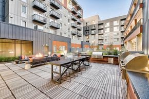 Redmond apartment for rent - an outdoor patio with a table and chairs in an apartment building