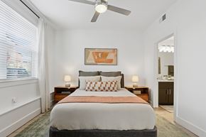 Parker apartment for rent - A bedroom with a large bed and a ceiling fan.