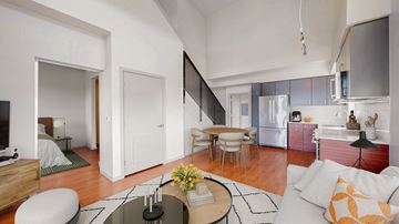 Redmond apartment for rent - A modern living room with a white sofa and a coffee table.