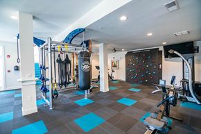 Charlotte apartment for rent - interior clubhouse fitness center with rock climbing wall