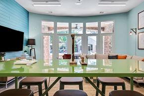 Atlanta apartment for rent - A dining room with a green table and chairs.
