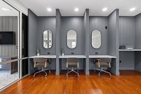 Shrewsbury apartment for rent - A modern office space with grey walls and wooden floors.