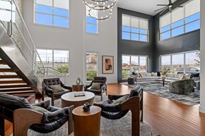 Shrewsbury apartment for rent - A living room with a staircase and a chandelier.
