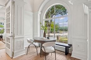 Frisco apartment for rent - a dining room with a large window and a table and chairs