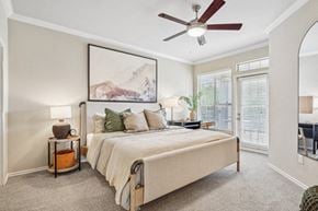 Frisco apartment for rent - a bedroom with a large bed and a ceiling fan
