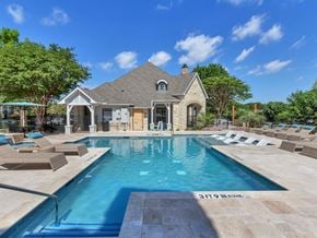 Frisco apartment for rent - A large house with a pool in front.
