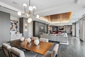 Charlotte apartment for rent - A modern dining room with a wooden table and grey chairs.