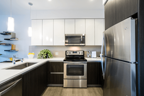 Oakland apartment for rent - A modern kitchen with a stainless steel refrigerator and oven.