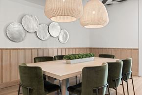 Tampa apartment for rent - A conference room with a long table and green chairs.
