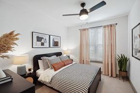 Garner apartment for rent - a bedroom with a bed and nightstand