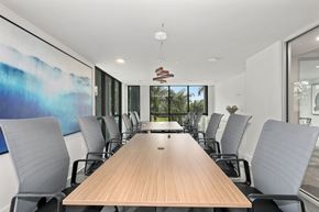 Boca Raton apartment for rent - A conference room with a long table and chairs.