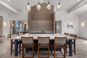 Austin apartment for rent - A modern dining room with a large table and chairs.