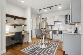 Sneads Ferry apartment for rent - a kitchen and living room with a bar and a table with chairs