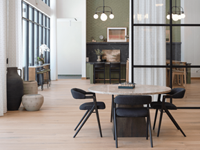 Alpharetta apartment for rent - A modern dining room with a white table and black chairs.