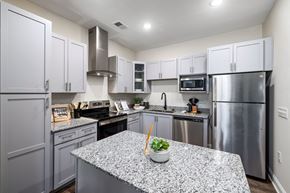 Mooresville apartment for rent - a kitchen with stainless steel appliances and granite counter tops