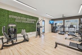 Knightdale townhouse for rent - A gym with a green wall that says