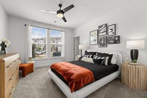 Monroe apartment for rent - A bedroom with a large bed and a ceiling fan.