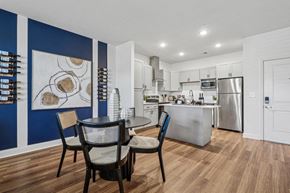 China Grove apartment for rent - A modern kitchen with a dining table and chairs.