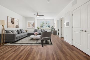 China Grove apartment for rent - A living room with a grey sofa and a coffee table.