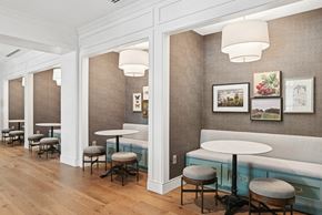Charlotte apartment for rent - Clubhouse booths with tables and chairs