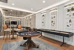 Charlotte apartment for rent - a game room with a shuffle board table and bumper pool