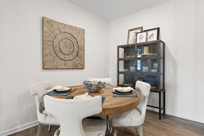 Holly Springs apartment for rent - A dining room with a wooden table and chairs.
