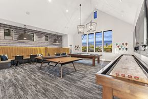 Longmont apartment for rent - a game room with tables and ping pong