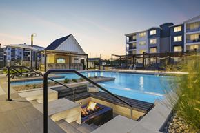 Longmont apartment for rent - A pool with a fire pit in the middle of it.