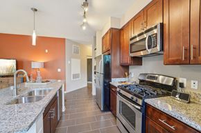 Odenton apartment for rent - a kitchen with stainless steel appliances and granite counter tops