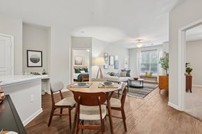 Charlotte apartment for rent - A dining room with a wooden table and chairs.